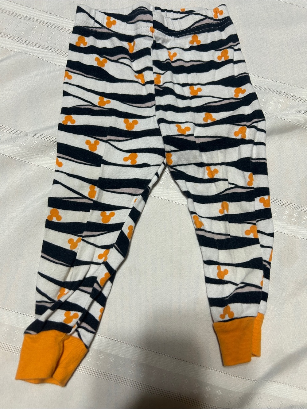 Kids Black and White Striped Leggings with Orange Accents